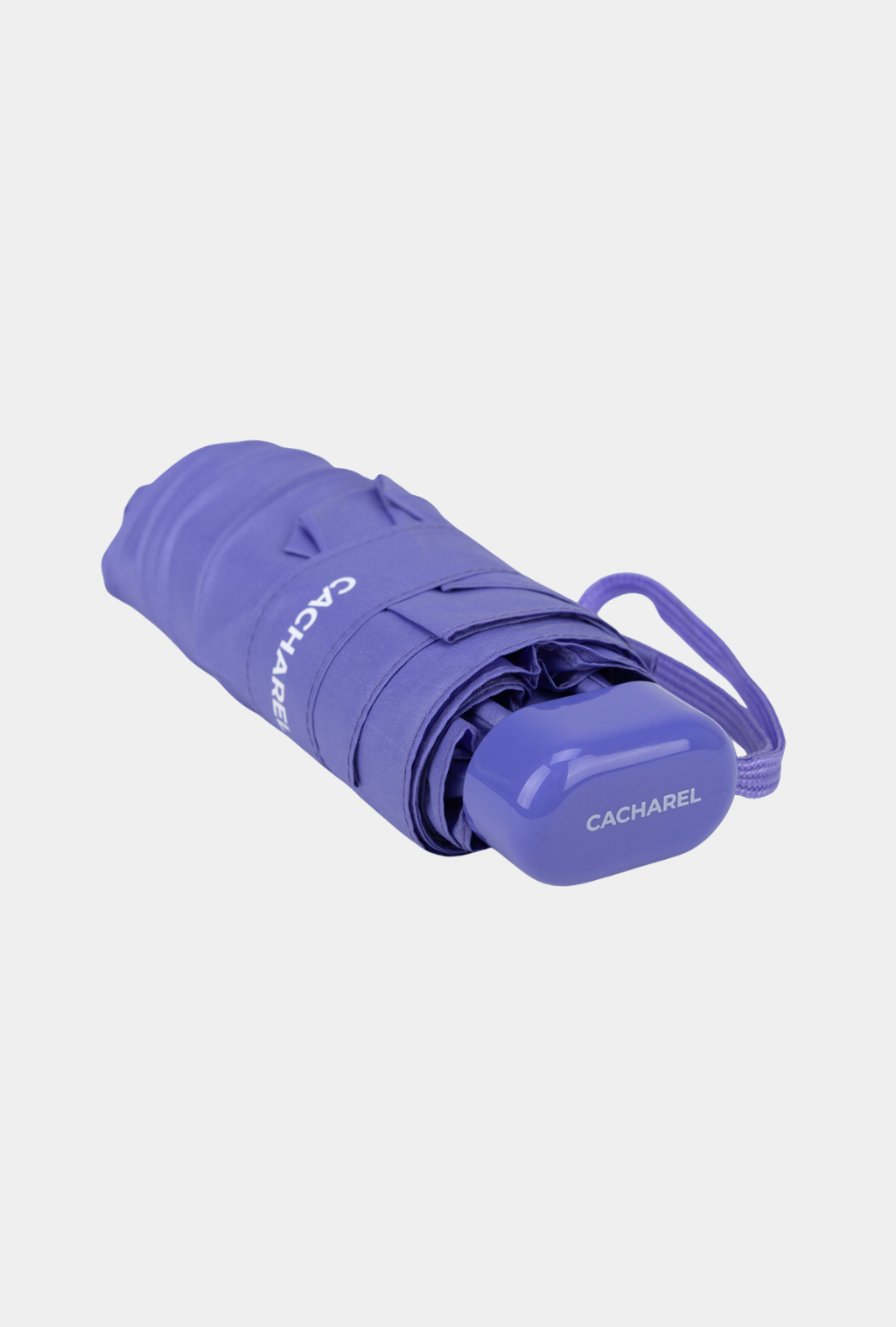 Paraguas plegable Cacharel con protección solar UPF 50+ color malva enrollado