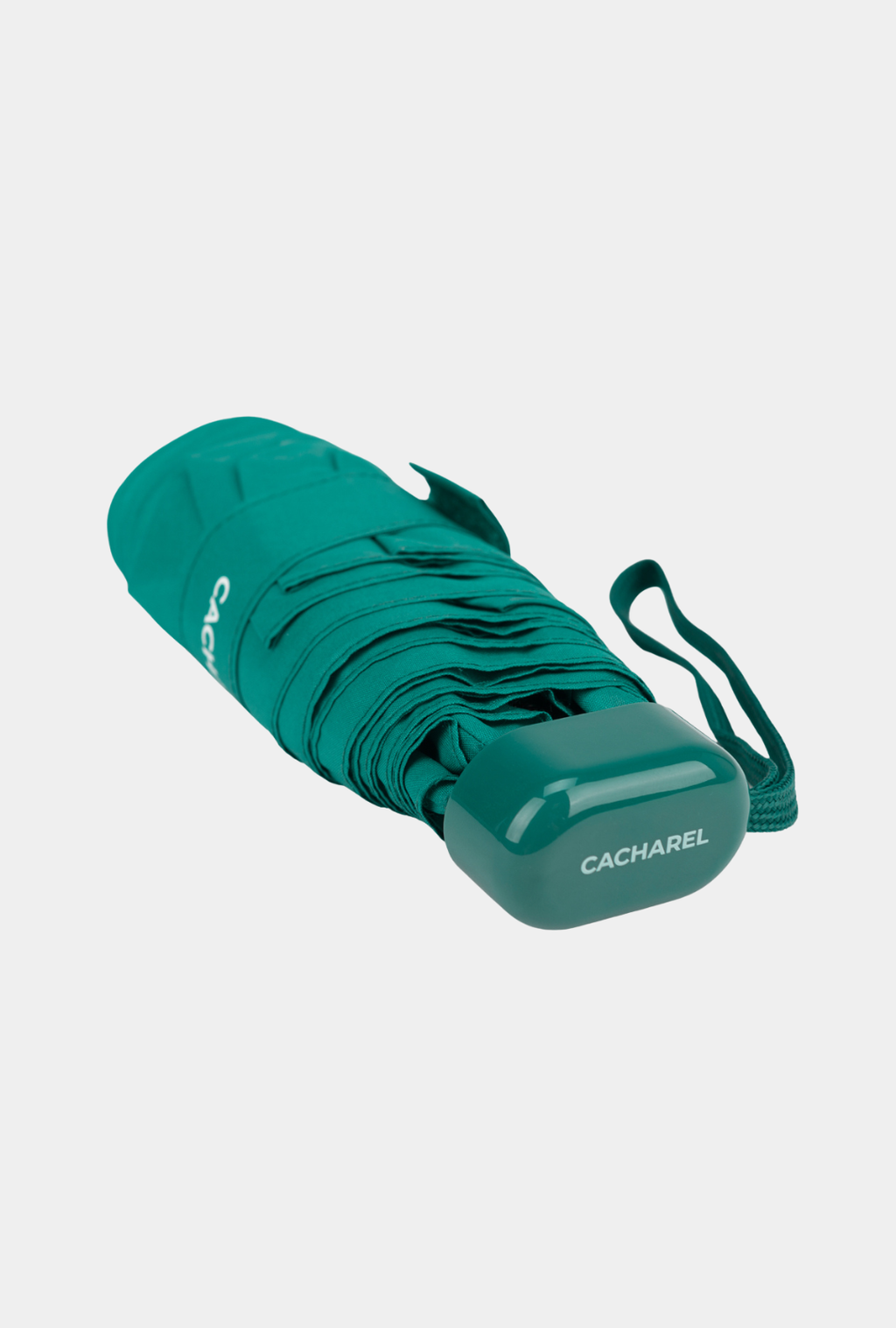 Paraguas plegable Cacharel con protección solar UPF 50+ color verde petróleo enrollado